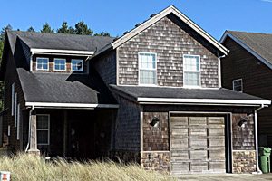 Two-story house with small garage for rent
