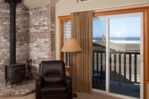 Living room with sliding window and wood stove