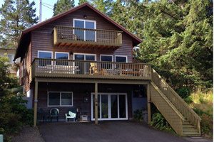 Three-story house with balcony and outdoor stairs
