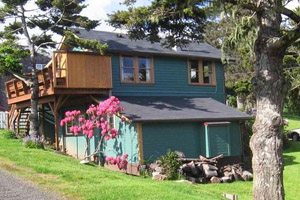 Blue two-story house with a yard