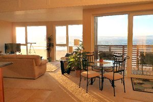 Living room interior with beach view windows
