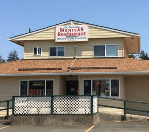 Two-story yellow building with Mexican Restaurant sign